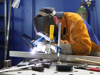 Hansen Mechanical fabricator working on a custom project in their prefabrication shop